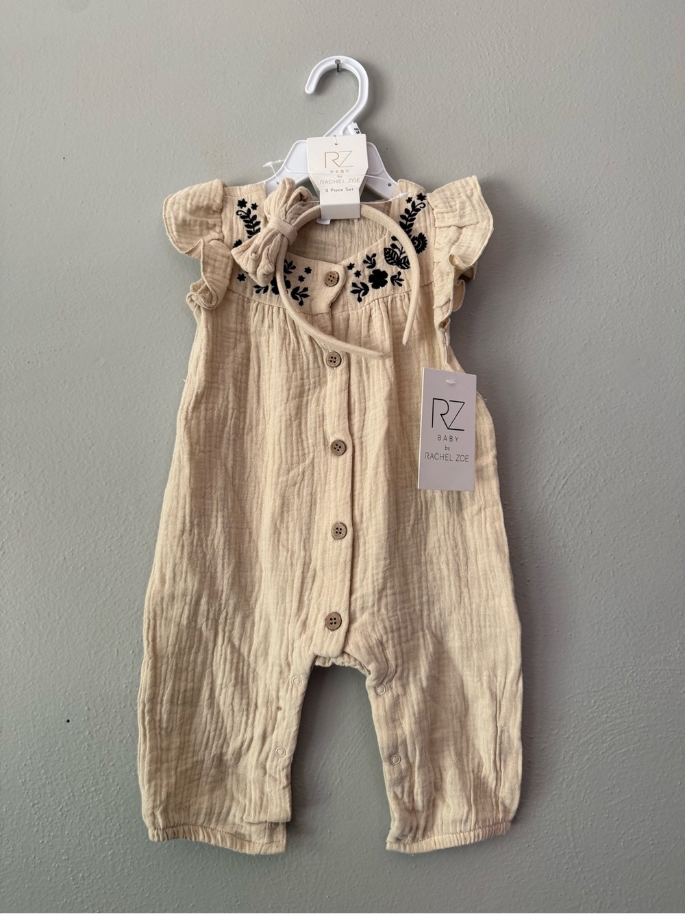Rachel Zoe Cream Baby Romper with Black Floral Embroidery